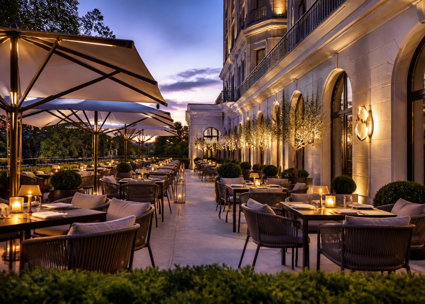 Hotel restaurant terrace with premium outdoor dining furniture at dusk